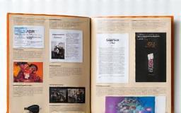 An open press kit folder displaying artist materials